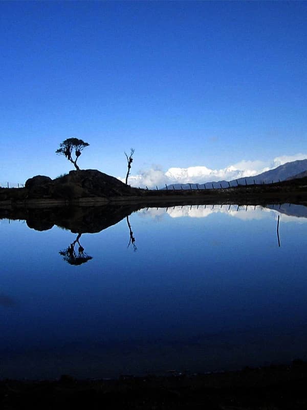 gufha pokhari lake and kanchenjuna mountain in the background