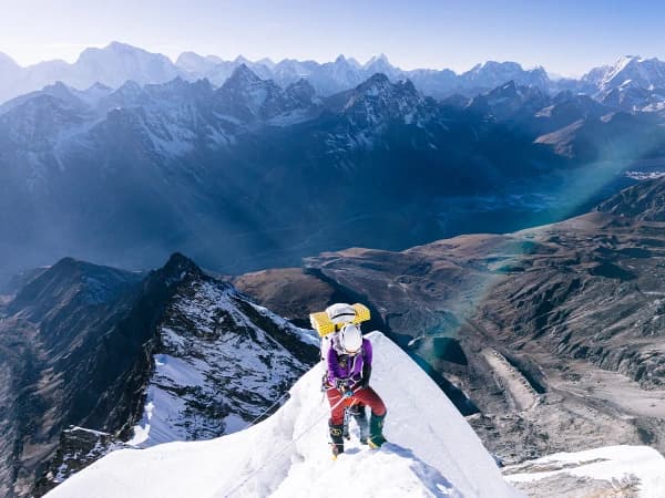 A Climber Ascending The Knife Ridge Enroute To Camp 2 After Climbing The Rock Face Above Camp 1